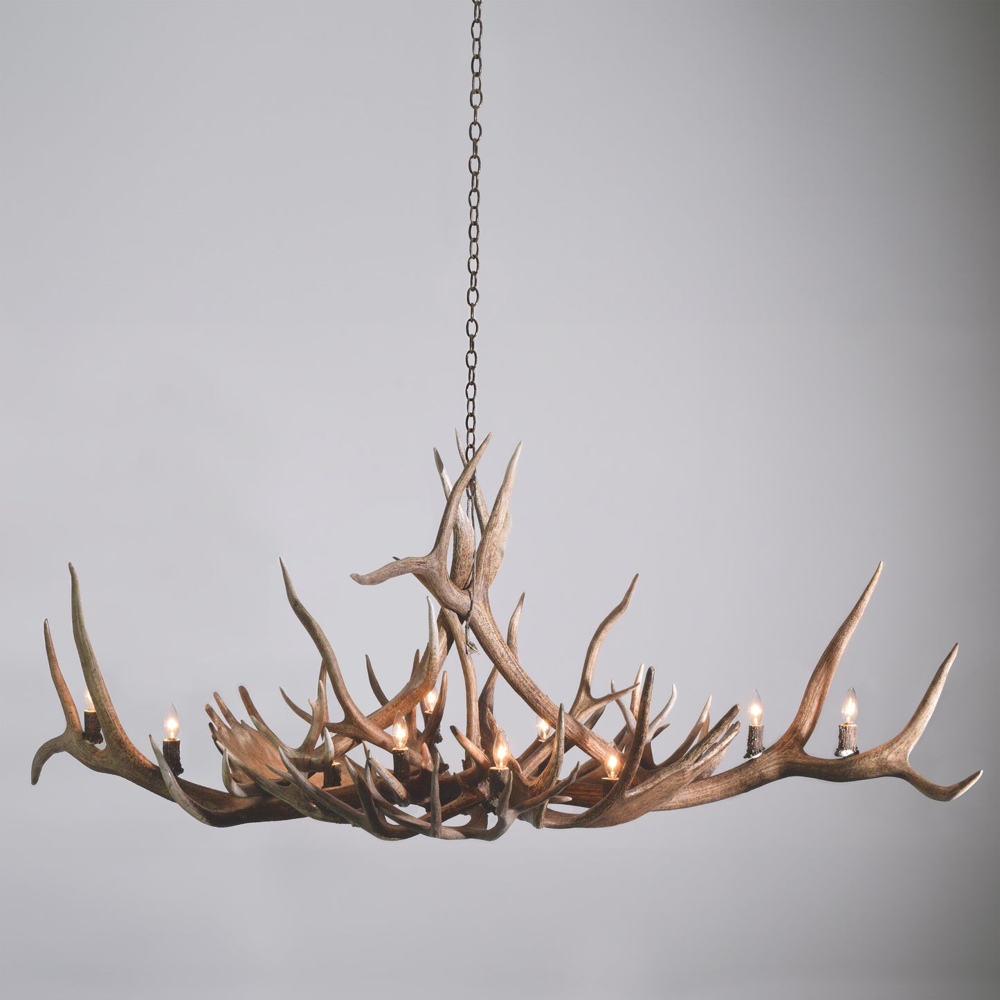 The Hayden Valley Antler Chandelier is crafted near Jackson Hole, Wyoming from large elk, moose, and deer antlers and measures almost 6 feet wide.